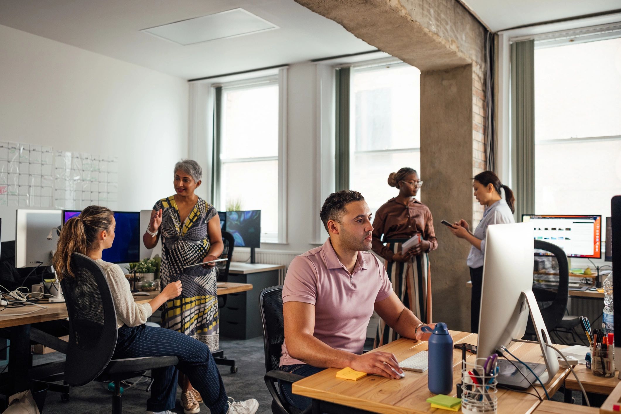 TERA Computer Pros team collaborating in a modern office